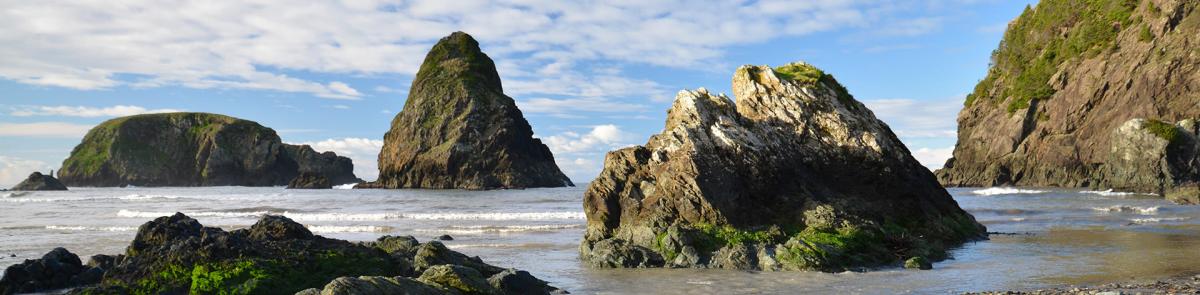 rock islands protruding from ocean shore