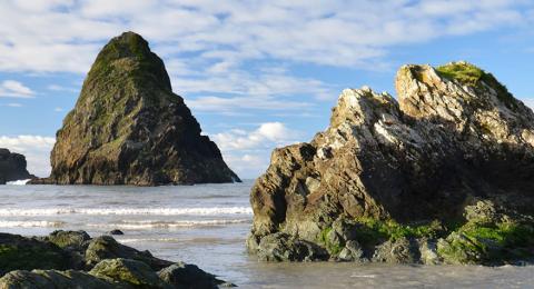 rock islands protruding from ocean shore