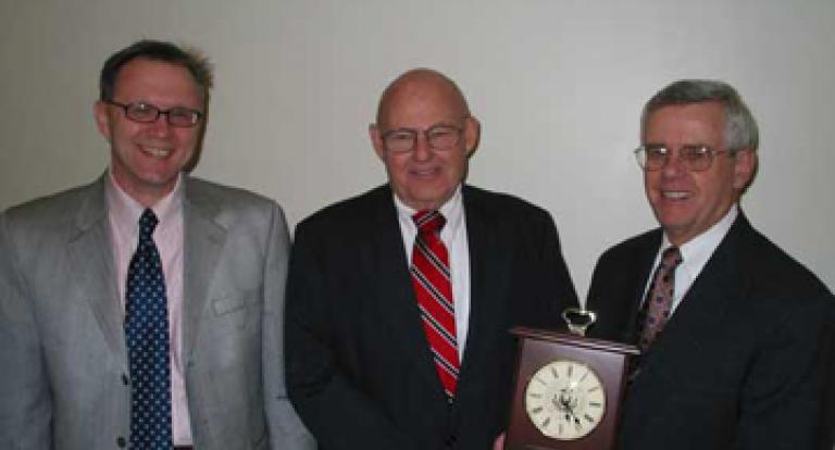 John Olson receiving an award