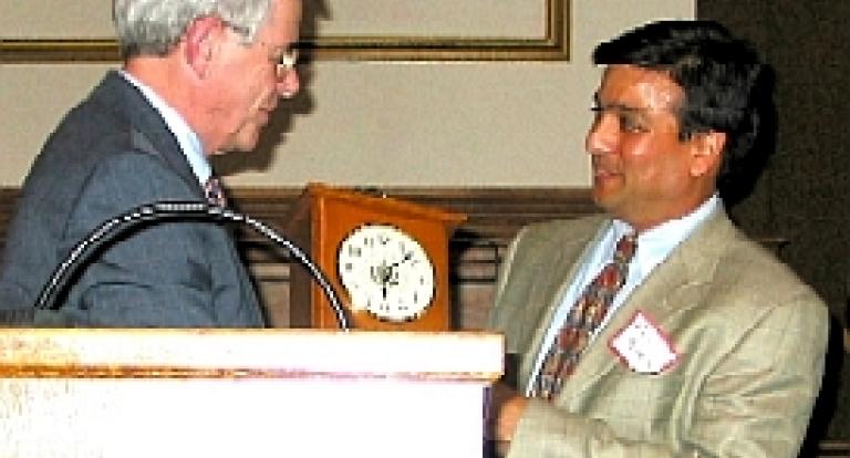 Rajiv Parikh receiving an award