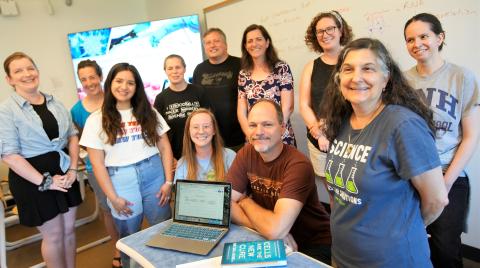 teachers looking at laptop