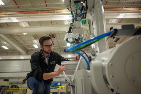 Staff working on machine