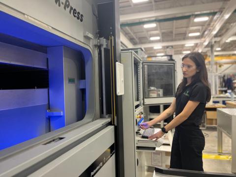 Maria Virga working with machinery at GreenSource Fabrication