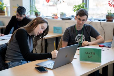 Mathematcs students working on math problems in the Mathematics Assistance Center