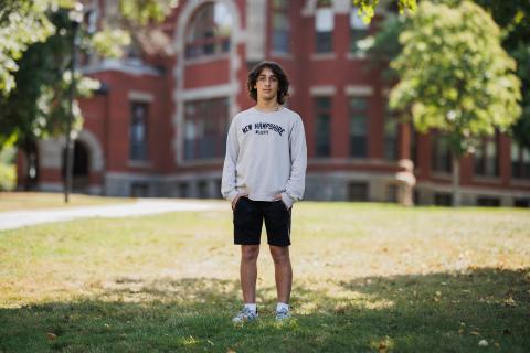 Pedro Doukas standing in front of T-hall