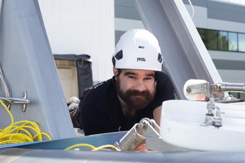 Exail Employee Inspecting Surface Vessel