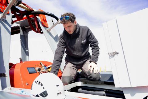 Exail Employee Inspecting the Surface Vessel