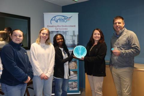 Olson Center team gicing Airtho a 3D printed thank-you gift for UNH's 603 challenge donation. 
