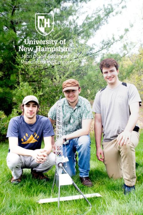 UNH Interns with the trebuchet they designed and built at the Olson center