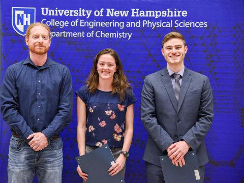 Prof. Erik Berda presents the Robert T. Hart Scholarship to Amina Gusic and Christopher LaSalle