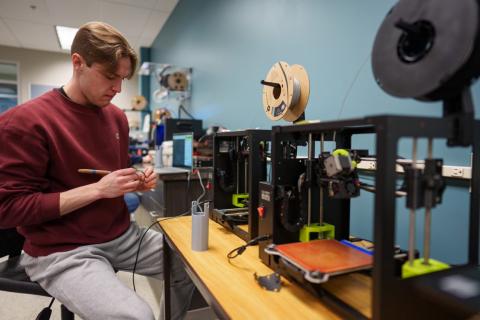 Douglas working on machines