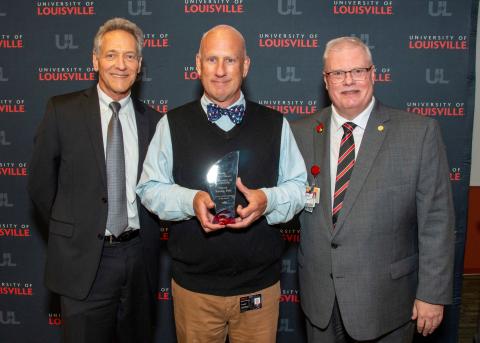 Steven Koenig receiving his award 