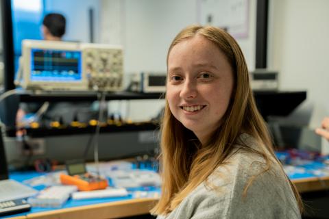 A electreical engineering, biomedical opton student working in lab to create medical ekg