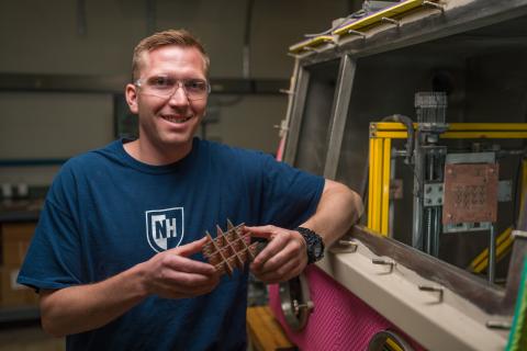 Ben Mitchell stands next to his Water Droplet Machining prototype