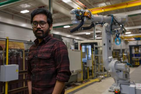 Abrar Ebrahim with ABB robot