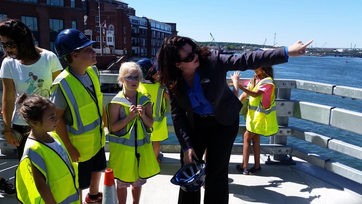 dr bell with young students at memorial bridge