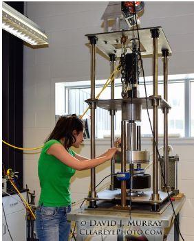 student working machine in lab