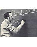 man writing on chalkboard