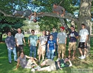 students posing under tree
