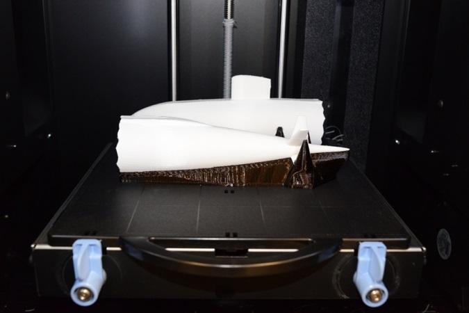 The 1:144 scale model of the USS Albacore coming out of the 3D printer
